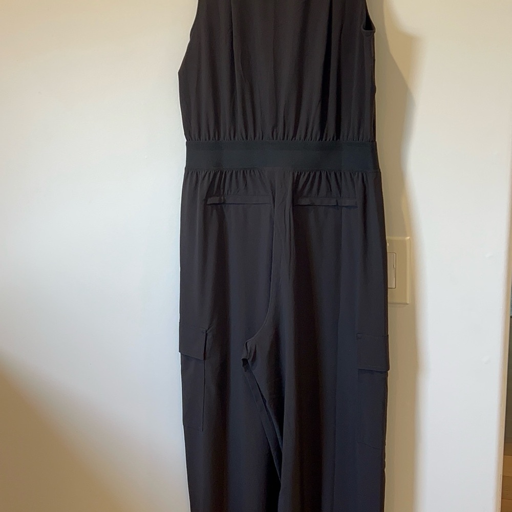 Athleta Sleeveless Utility Black Jumpsuit with front zip.